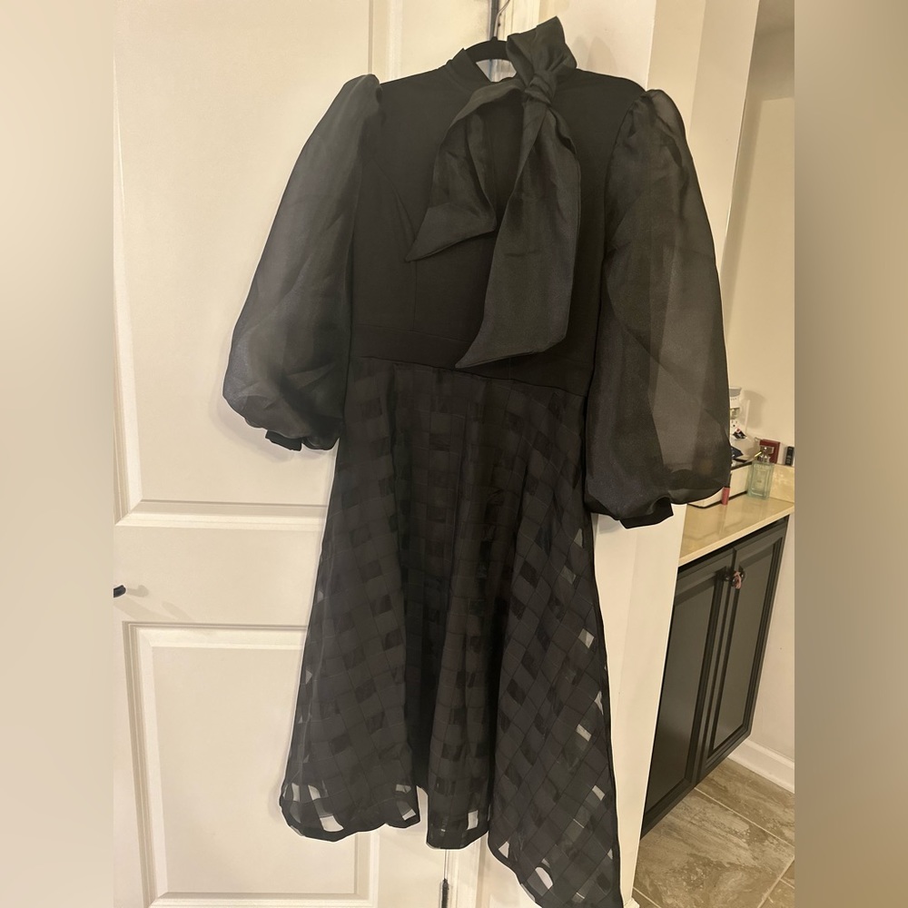 Black midi dress with dramatic bow and balloon sleeve. Size S